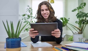 virtual-online-lesson-smiling-teenager-guy-learns-2022-05-25-01-01-43-utc.jpg
